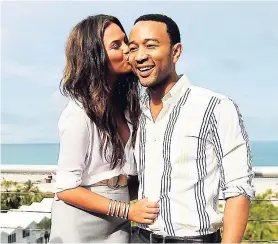  ??  ?? John Legend (right) and wife Chrissy Teigen