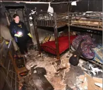  ?? JOHN RENNISON, THE HAMILTON SPECTATOR ?? Cindy Hart stands in a basement bedroom following the fire. She and her husband and eight kids have been offered temporary lodging until April.