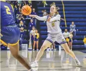  ?? STAFF PHOTO BY OLIVIA ROSS ?? UTC’s Sigrun Olafsdotti­r passes during a SoCon game against ETSU on Feb. 4 at McKenzie Arena.