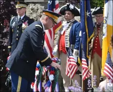  ?? MEDIANEWS GROUP FILE PHOTO ?? Kenneth Seitz, deputy commandant, Valley Forge Military Academy and College, places a wreath at the Radnor War Memorial at the Radnor Memorial Day service in 2016.