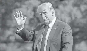  ?? N.J. J. SCOTT APPLEWHITE/AP ?? President Donald Trump waves as he arrives at the White House on Sunday after a weekend at his golf club in Bedminster,