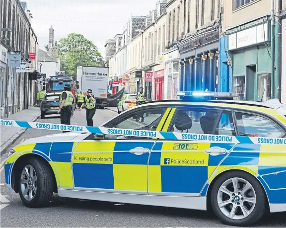  ?? Picture: George Mcluskie. ?? Police cordoned off the accident scene in Bell Street, St Andrews, after a woman was seriously injured.