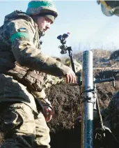  ?? ANATOLII STEPANOV/GETTY-AFP ?? Ukrainian soldiers fire a mortar Friday from their position not far from Bakhmut in Ukraine’s Donetsk region, which Russia has claimed as its own territory.
