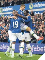  ??  ?? ■ Romelu Lukaku is mobbed.