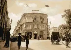  ?? Sepia Times / Universal Images Group via Getty Images ?? JERUSALEM’S Hotel Fast, which features in Wilson’s new novel, f lew both British and Nazi flags in the 1930s, a reflection of the era’s unrest.