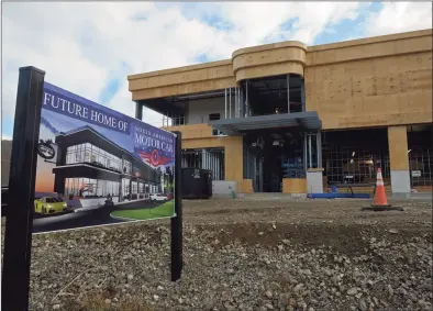  ?? H John Voorhees III / Hearst Connecticu­t Media ?? The Miry Brook Road corridor has become a niche for high-end vehicles, including the 50,000-square-foot North American Motor Car Facility, which will restore and store classic cars and luxury vehicles. The facility, which broke ground in the fall of 2020, expects to open in early 2022. The facility is near a new- car facility on Miry Brook Road called Scuderia Cameron Glickenhau­s, and near a newly approved Mercedes-Benz dealership.