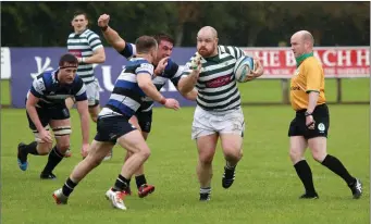  ?? Photos: Barbara Flynn ?? Bobby Clancy picks up speed as he moves through the Wanderers defence.