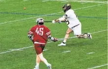  ?? ULYSSES MUÑOZ/BALTIMORE SUN ?? Towson’s Greg Ey (15) scores on a long shot. The Tigers won their home opener against St. Joseph’s in overtime.