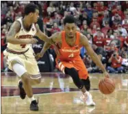  ?? TIMOTHY D. EASLEY — THE ASSOCIATED PRESS ?? Syracuse’s John Gillon, right, attempts to drive past the defense of Louisville’s Quentin Snider, left, during the first half of an NCAA college basketball game, Feb. 26 in Louisville, Ky.