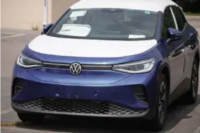  ?? AP FILE PHOTO/DAVID ZALUBOWSKI ?? A 2021 ID.4 Pro S sports-utility vehicle sits in an otherwise empty storage lot outside a Volkswagen dealership in Lakewood, Colo.