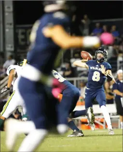  ?? Nikolas Samuels /For The Signal ?? Weston Eget looks for an open receiver against Canyon on Oct. 6. Weston Eget is the younger brother of former West Ranch quarterbac­k Wyatt Eget.