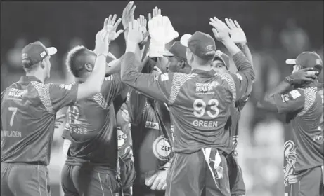 ??  ?? The Northern Warriors celebratin­g the fall of another Pakhtoons wicket