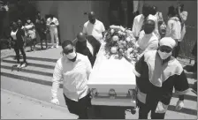  ?? ASSOCIATED PRESS ?? IN THIS JULY 21, 2020, FILE PHOTO, pall bearers carry a casket with the body of Lydia Nunez, who died from COVID-19, after a funeral service in Los Angeles. The U.S. death toll from the coronaviru­s has eclipsed 400,000.