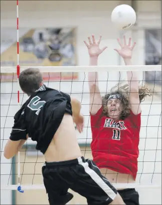  ?? Nikolas Samuels
/The Signal ?? (Above) Canyon’s Dustin Deisbeck, left, tries to go for a kill over Hart’s Jake Meyers (11) at Canyon on Tuesday. Hart swept all three games. (Left) Deisbeck (5) hits the ball during a home match against Hart on Tuesday.