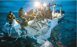  ?? U.S. NAVY ?? Sailors recover the remnants of a suspected Chinese spy balloon Feb. 5 off the coast of Myrtle Beach, S.C.