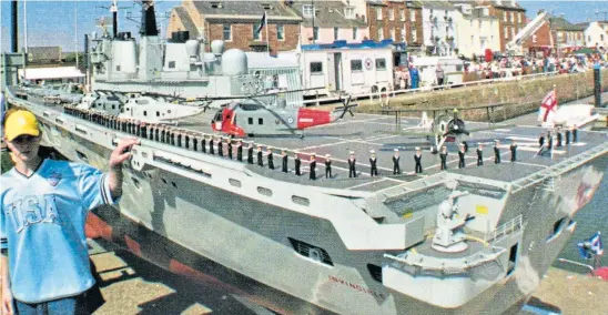  ?? ?? Ian Wallace took this picture of a giant model of HMS Invincible and a young admirer at Arbroath Sea Fest in 2005. See left for more.