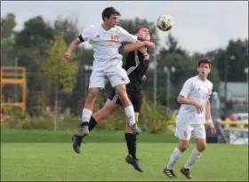  ?? AUSTIN HERTZOG - DIGITAL FIRST MEDIA ?? Perkiomen Valley’s Brian Love (10) wins a header against Boyertown’s Kolby Houck Tuesday.