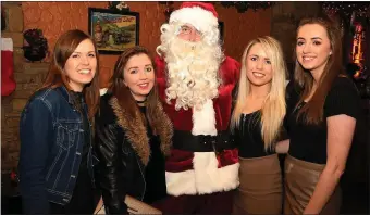  ??  ?? Marian Dineen, Ciara O’Doherty, Eileen Dineen and Caroline Dineen, Rathmore, with Santa Claus at The Killarney Grand Christmas and Birthday Party on Monday night celebratin­g the annual Customer Appreciati­on night and 21st year in business in Killarney....