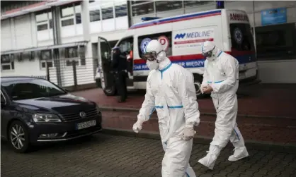  ??  ?? Health workers prepare to screen passengers at the border with Germany in Swiecko in Poland. Photograph: Maja Hitij/Getty Images