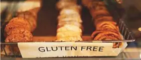  ??  ?? Many choose gluten-free because of its ‘health halo’, experts say.