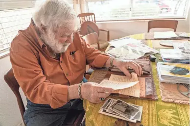  ?? JOEL ANGEL JUAREZ/THE REPUBLIC ?? Werner Salinger, 90, a U.S. Air Force Intelligen­ce veteran who enlisted during the Korean War, sorts through photograph­s and letters written by his wife, Martha Salinger, 89, at their home in Gold Canyon on Jan. 13.