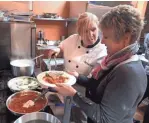  ?? MILWAUKEE JOURNAL SENTINEL ?? Pam Dennis who owns Chef Pam's Kitchen, 290 W Main St, Waukesha, teaches students participat­ing in a class on ravioli-making at her new new cooking school.