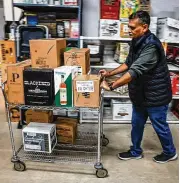  ?? JIM NOELKER / STAFF ?? Jay Patel, co-owner of Centervill­e Liquor & Wine, on Friday mentioned a bourbon craze: “I think more and more people are going towards that.”