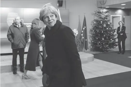  ?? DARIO PIGNATELLI/BLOOMBERG ?? British Prime Minister Theresa May leaves after attending a European Union leaders summit in Brussels on Friday. after the first phase of Brexit talks, EU leaders said “sufficient progress” had been made to start discussing a trade deal and future...