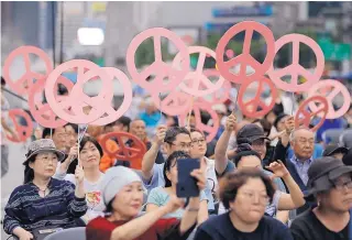  ?? LEE JIN-MAN/ ASSOCIATED PRESS ?? Koreans rally near the U.S. embassy in Seoul, South Korea, on Saturday, for a successful summit between U.S. President Donald Trump and North Korea’s leader Kim Jong Un and for peace on the Korean peninsula.