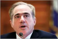  ?? AP PHOTO BY JACQUELYN MARTIN ?? In this Feb. 6, file photo, Veterans Affairs Secretary David Shulkin speaks during a House Committee on Veterans’ Affairs hearing on veteran caregiver support on Capitol Hill in Washington. Shulkin is hanging onto his job by a thread.