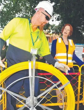  ?? CABLE CONNECTION: Former Prime Minister Julia Gillard visited Townsville progress of the NBN rollout. in 2012 to check the ??