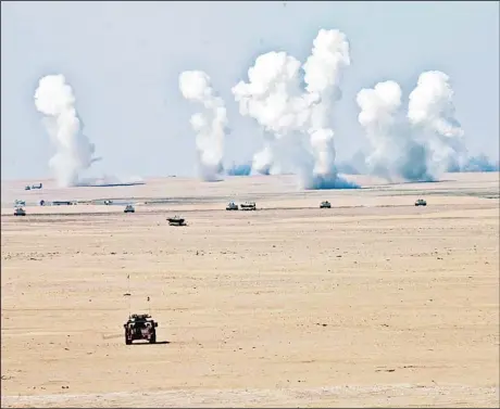  ?? Photo by Ahmad Al Naqeeb ?? Tanks take part in a military exercise at Udaira military range, 140 kms north of Kuwait City as part of joint GCC military exercises during celebratio­ns to mark
Kuwait National Days.