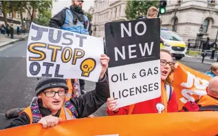  ?? ?? Roadblock: Just Stop Oil activists stage a sit-down protest in Whitehall