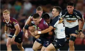  ?? Photograph: Regi Varghese/Getty Images ?? Queensland’s James O’Connor is tackled by the ACT Brumbies’ Allan Alaalatoa during the Brumbies’ two-point loss at Suncorp Stadium on Saturday.