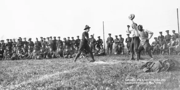  ??  ?? Canadian and American troops play baseball in France in May 1918.