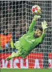  ?? REUTERS ?? Arsenal’s David Raya attempts to save a Marko Grujic penalty during Tuesday’s Champions League shootout.