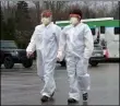  ?? CHRISTOPHE­R MILLETTE ?? Registered nurse Stephanie Crilley, left, and nurse practition­er April Sweeney prepare to begin testing Friday, March 20, 2020, at the drive-through testing site at the AHN Health + Wellness Pavilion in Millcreek Township near Erie, Pa.