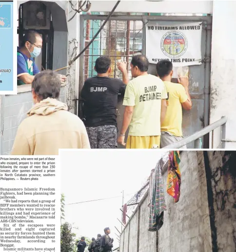  ??  ?? Prison inmates, who were not part of those who escaped, prepare to enter the prison following the escape of more than 150 inmates after gunmen stormed a prison in North Cotabato province, southern Philippine­s. — Reuters photo Armed police patrol along...