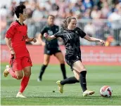  ?? ?? Liv Chance shapes to shoot in the Football Ferns’ game against South Korea in Christchur­ch, tracked by Korean captain Kim Hye-ri.