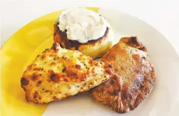  ?? PHOTO BY SARA JACKSON ?? Bread & Butter Bakery offers a variety of pastries, such as the Mustard & Gruyere Scone, cinnamon roll and Cowboy Pocket, clockwise from left.