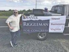  ?? BY JOHN MCCASLIN ?? GOP congressio­nal candidate Denver Riggleman of Nelson County before marching in Amissville's annual parade Thursday night.