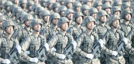  ??  ?? Members of China’s People’s Liberation Army.