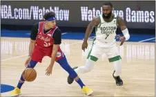  ?? CHRIS SZAGOLA – THE ASSOCIATED PRESS ?? Sixers guard Seth Curry, left, looks to make his move against Boston’s Jaylen Brown during the first half Friday night at Wells Fargo Center.