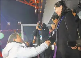  ?? GETTY IMAGES ?? Kim Yo Jong, right, the sister of North Korean leader Kim Jong Un, shakes hands with South Korean President Moon Jae-in during the opening ceremony in Pyeongchan­g.