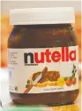  ?? TOBIAS HASE / AFP / GETTY IMAGES ?? Ferrero is shrinking the size of its Nutella containers in an effort to avoid a
price increase.