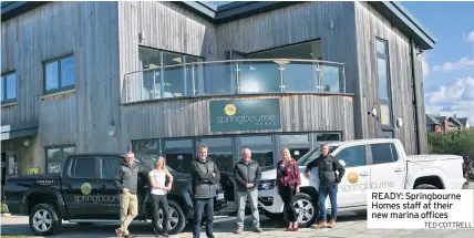  ?? TED COTTRELL ?? READY: Springbour­ne Homes staff at their new marina offices