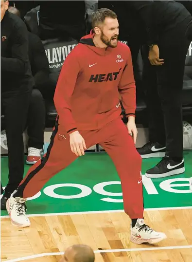  ?? ADAM GLANZMAN/GETTY ?? The Heat’s Kevin Love reacts against the Celtics in Game 7 on Monday at TD Garden in Boston.