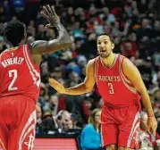  ?? Nam Y. Huh / Associated Press ?? Rockets forward Ryan Anderson, right, celebrates with Pat Beverley after scoring three of his 21 points.