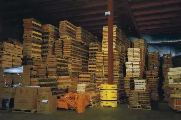  ?? DA’SHAUNAE MARISA — THE NEW YORK TIMES ?? Boxes of products sit in a warehouse at American Fireworks, run by the same family for five generation­s, in Hudson, Ohio.