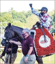  ?? Skip Dickstein / Special to the Times Union ?? Jack Knowlton, managing partner of Sackatoga Stables, leads Tiz the Law with jockey Manny Franco to the winner’s circle after winning the Travers Stakes at Saratoga on Aug. 8.